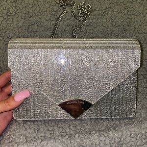 Michael Kors silver envelope clutch with removable chain. Brand new.